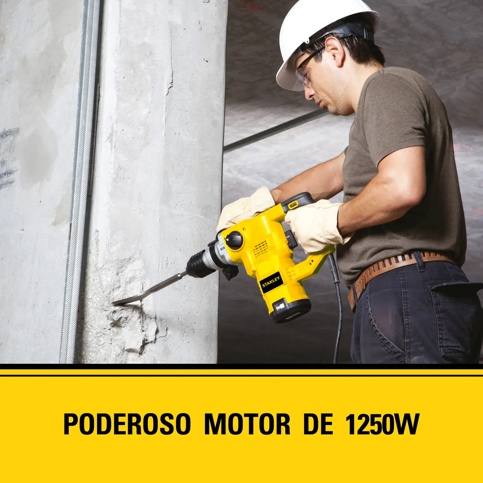 Una persona con guantes de seguridad y casco está usando un martillo rotativo eléctrico amarillo STANLEY sobre un pilar de concreto. El texto en la parte inferior dice: 'Poderoso motor de 1250W.'